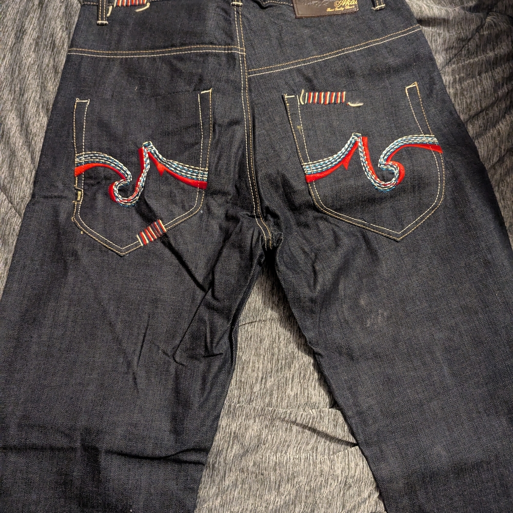 Red and Blue Bootcut Jeans with Decorative Stitching
